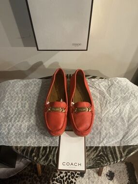 Coach Women's burnt orange Leather Moccasin Loafers with Gold Plaque